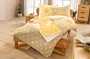 Frühlingshafte Bettwäsche aus Bio-Baumwolle mit Sonnen-Motiv